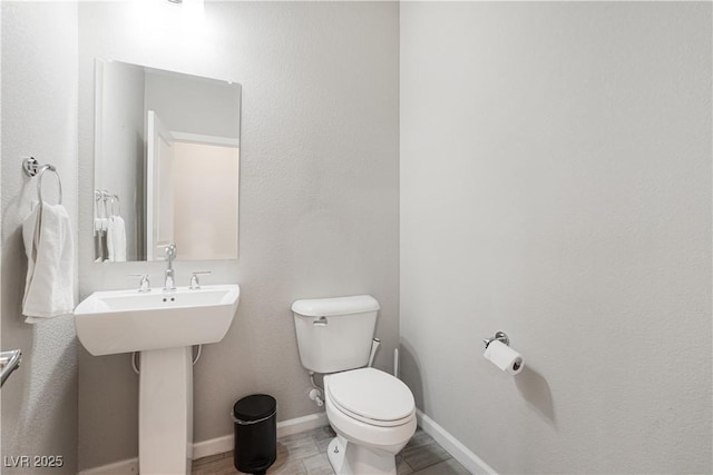 bathroom with toilet and sink