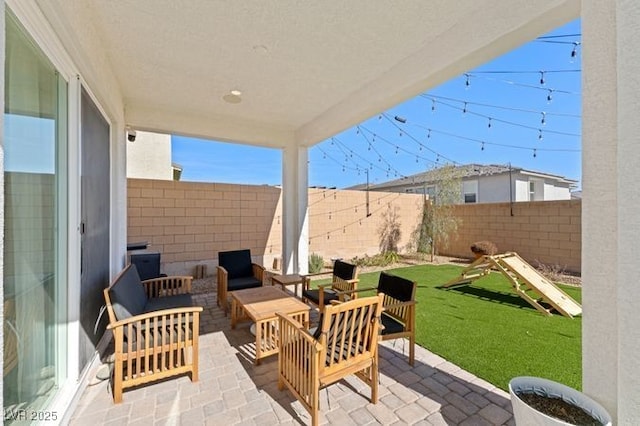 view of patio / terrace with a fenced backyard and an outdoor living space