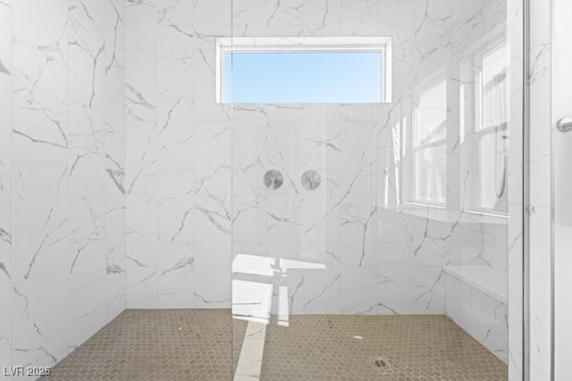 full bathroom featuring a tile shower