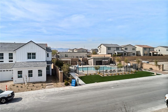 exterior space with a residential view and curbs