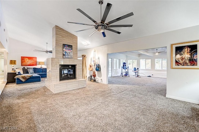 carpeted living room featuring a fireplace, ceiling fan, and lofted ceiling