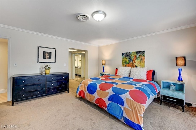 bedroom featuring carpet flooring, connected bathroom, and crown molding