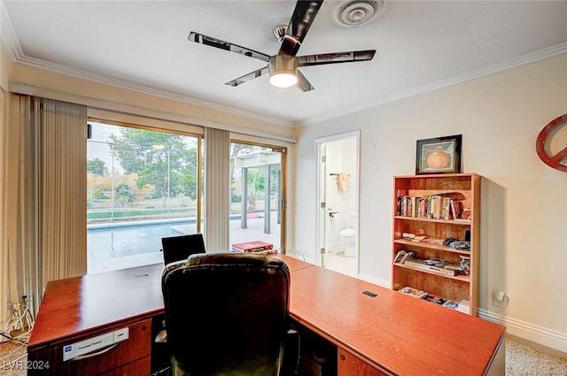 office space featuring visible vents, baseboards, ceiling fan, and crown molding