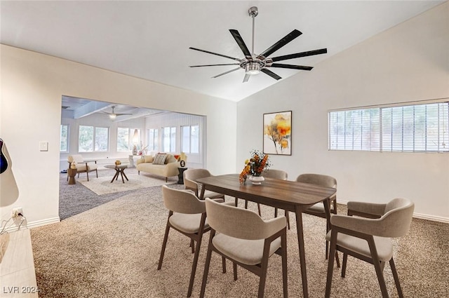 dining space with ceiling fan and vaulted ceiling