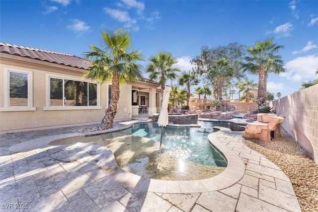 view of pool featuring an in ground hot tub and a patio