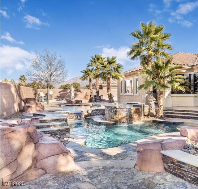 view of pool with pool water feature