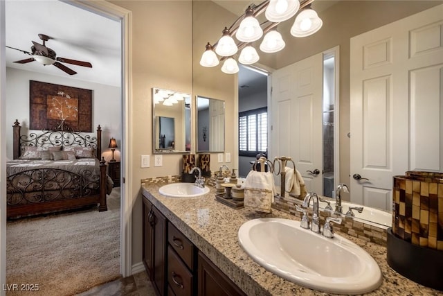 bathroom with ceiling fan and vanity