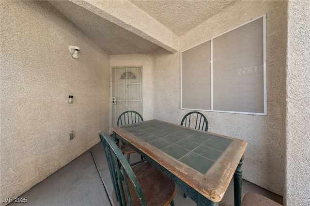 dining room with lofted ceiling