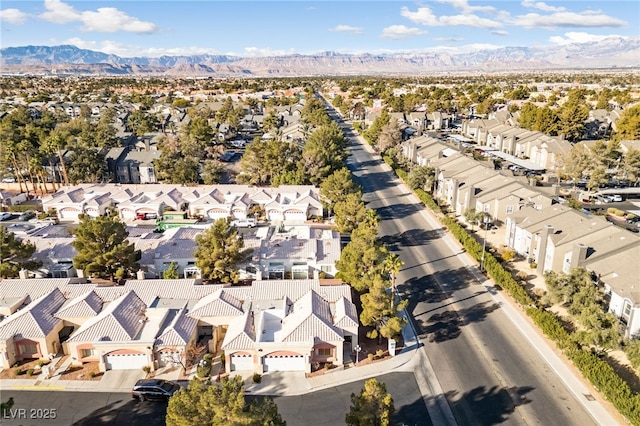 birds eye view of property featuring a mountain view