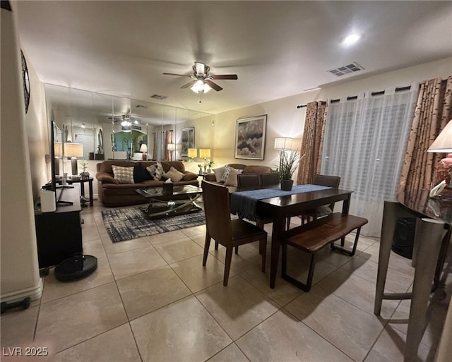 dining room featuring ceiling fan and light tile patterned floors