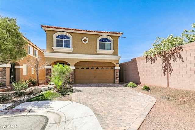 mediterranean / spanish-style home featuring a garage