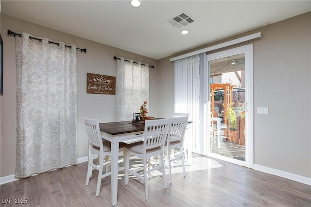 dining area featuring hardwood / wood-style flooring