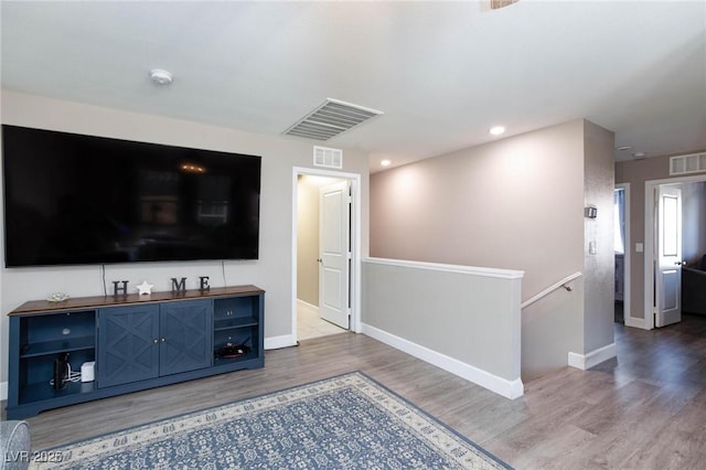 unfurnished living room with wood-type flooring