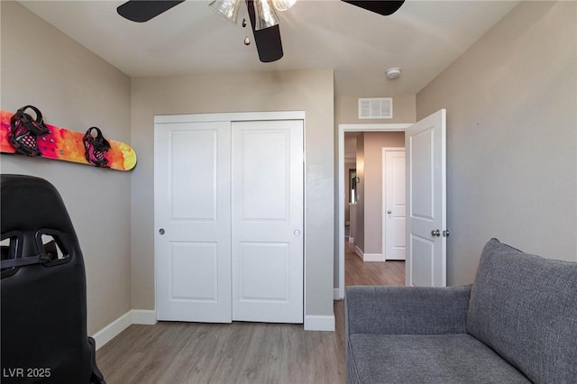 interior space with hardwood / wood-style flooring and ceiling fan