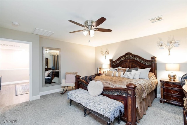 bedroom featuring light carpet and ceiling fan