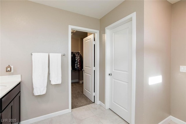 bathroom with tile patterned flooring and vanity