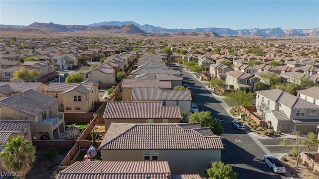 birds eye view of property featuring a mountain view