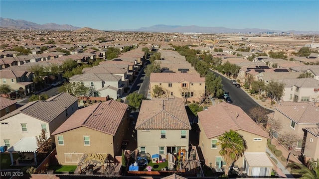 birds eye view of property featuring a mountain view