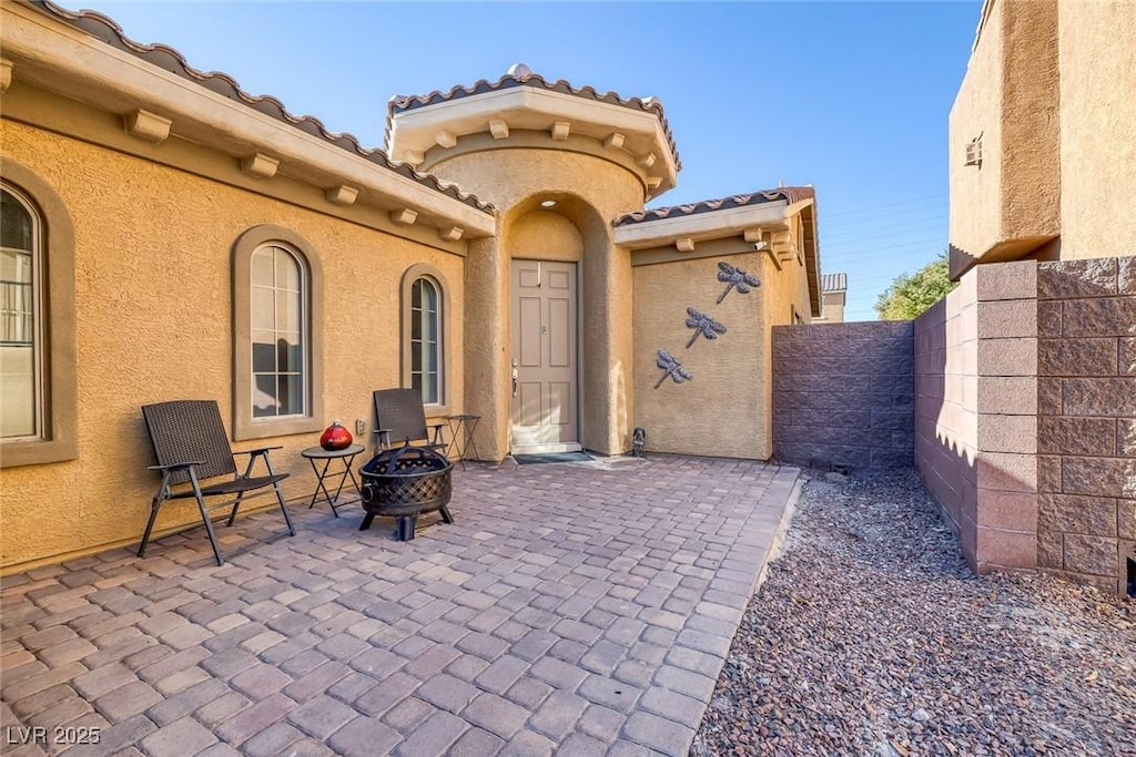 view of patio / terrace with an outdoor fire pit