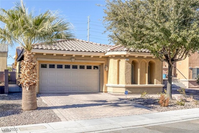 mediterranean / spanish-style home featuring a garage