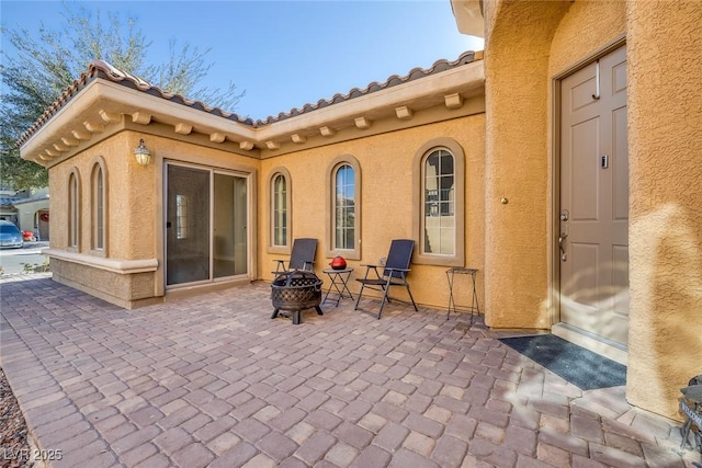 view of patio / terrace with a fire pit