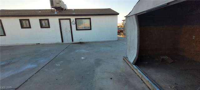 rear view of house featuring a patio