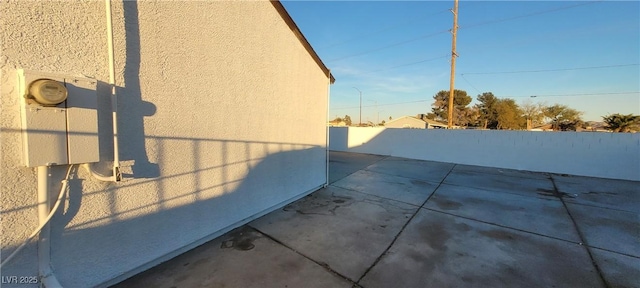 view of side of home featuring a patio