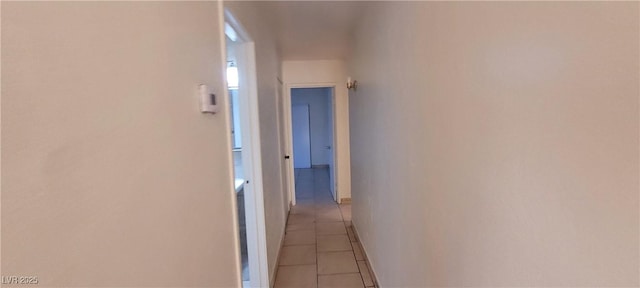 corridor featuring light tile patterned floors