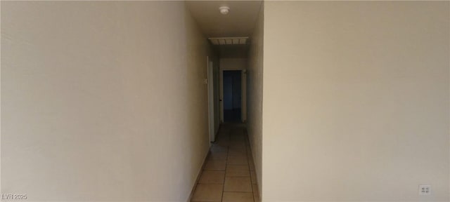 hall featuring tile patterned flooring