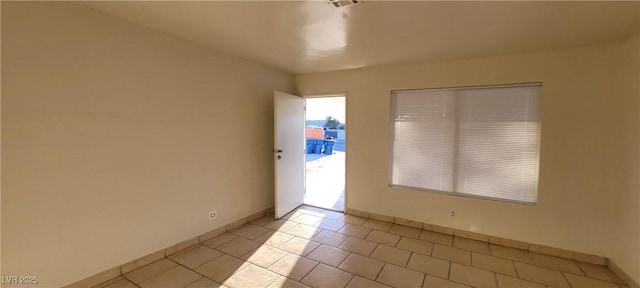 view of tiled spare room