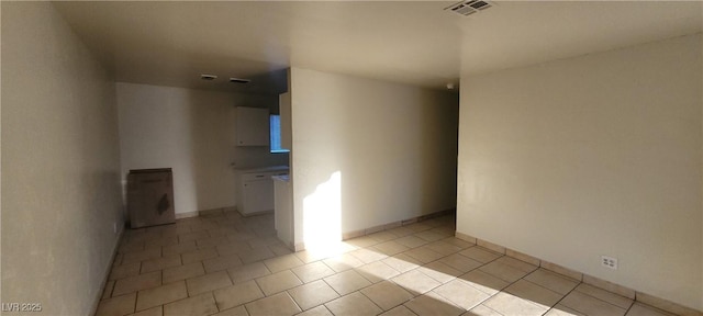 empty room with light tile patterned floors