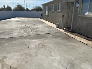 view of side of home with a patio area