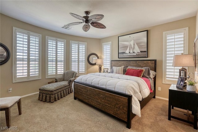 bedroom featuring ceiling fan and light colored carpet