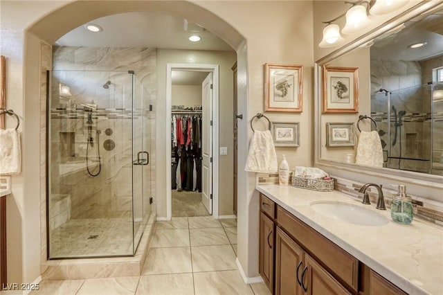 bathroom featuring vanity and walk in shower