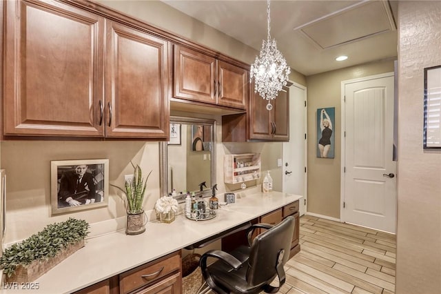 kitchen with decorative light fixtures and built in desk