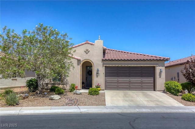 mediterranean / spanish-style house featuring a garage