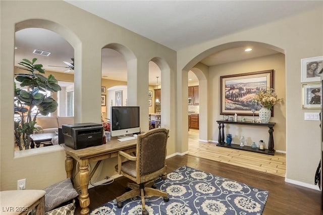 office area with dark hardwood / wood-style floors and ceiling fan