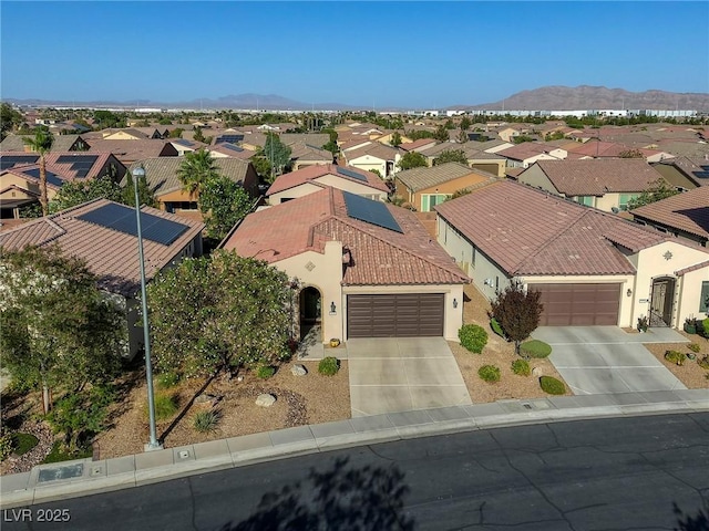 birds eye view of property featuring a mountain view