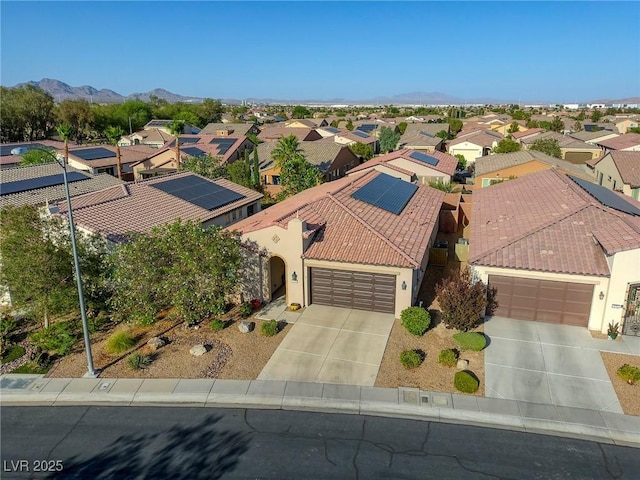 birds eye view of property featuring a mountain view