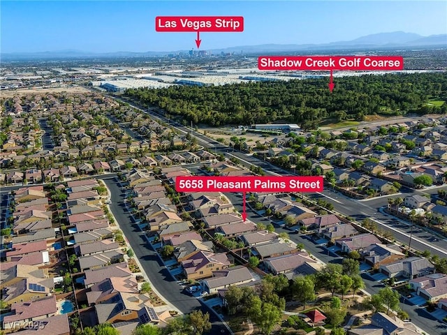 birds eye view of property featuring a mountain view