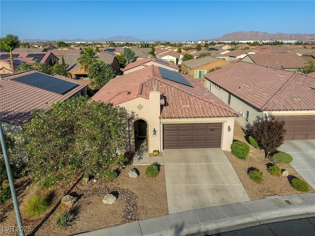 birds eye view of property featuring a mountain view