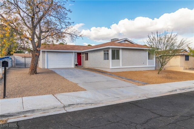 ranch-style house featuring a garage