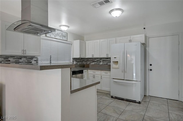 kitchen with stainless steel dishwasher, white refrigerator with ice dispenser, island exhaust hood, kitchen peninsula, and white cabinets