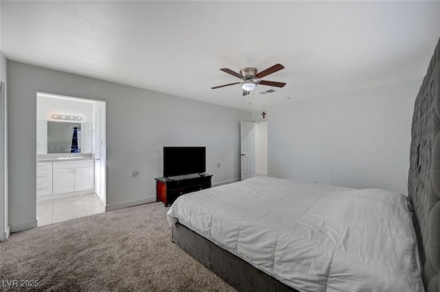 carpeted bedroom featuring ceiling fan and connected bathroom