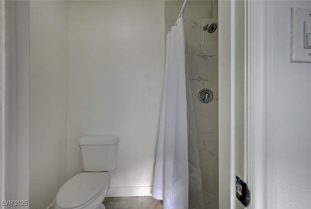 bathroom with toilet and walk in shower