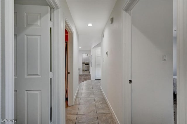 hallway featuring light tile patterned floors