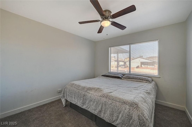 bedroom featuring dark carpet and ceiling fan