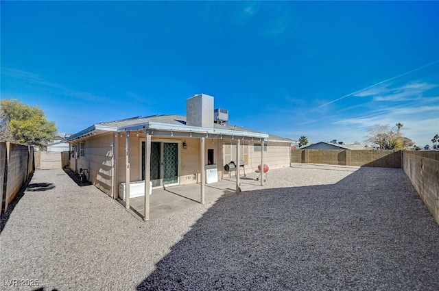 rear view of property featuring a patio area