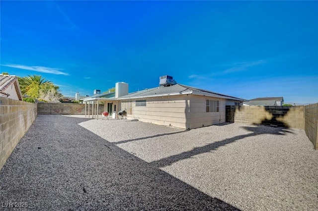 back of property with a patio