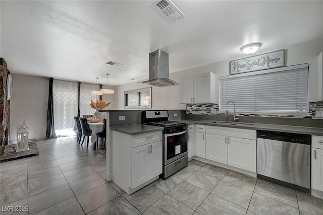 kitchen featuring white cabinets, stainless steel appliances, kitchen peninsula, and range hood